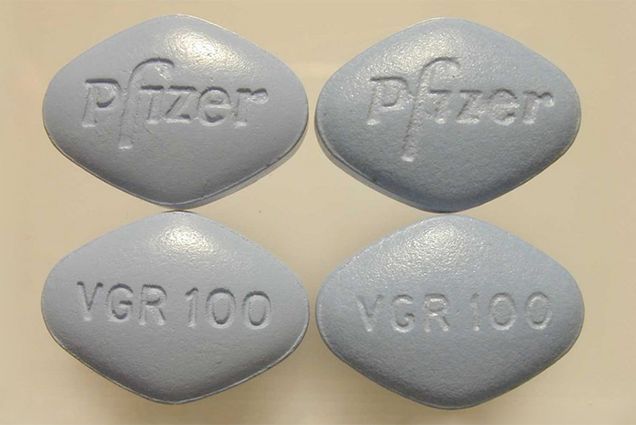 Real and counterfeit Viagra pills side by side. Real Viagra is on the right.