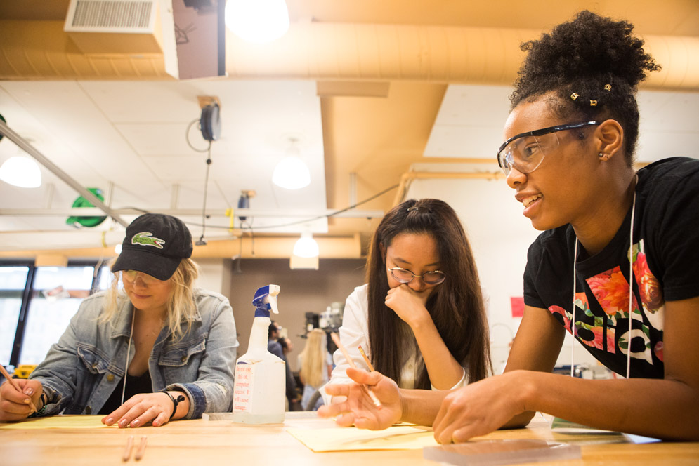Questrom students sketch out a plan for their tower.