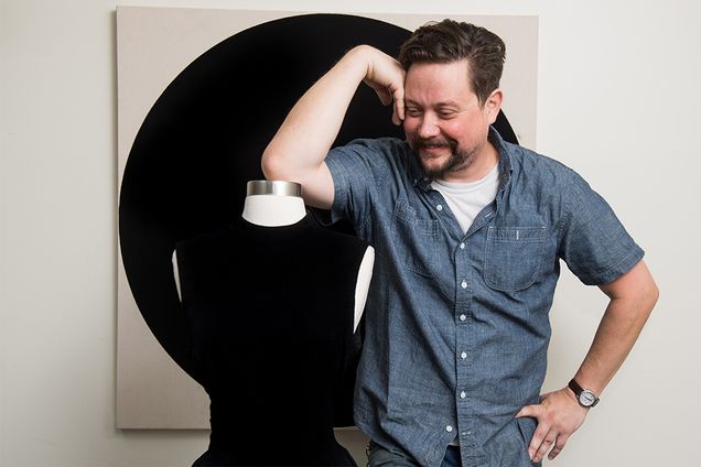 Jason Chase, painter and artist-in-residence at NanoLabs, poses with a black dress painted with Singularity Black paint that will be on display at the Boston Museum of Fine Arts