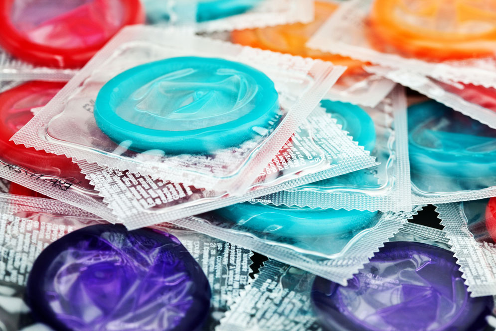 a pile of multicolored condoms