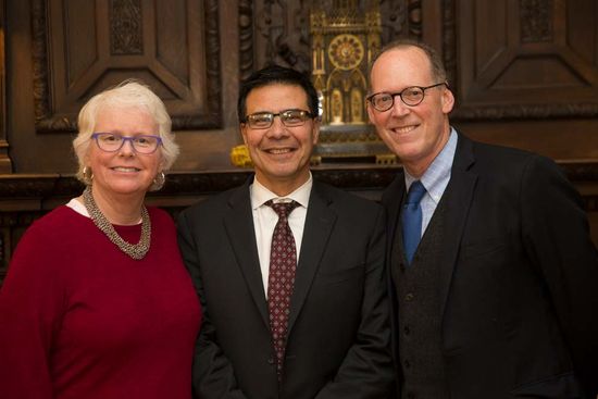 Jean Morrison, University provost, Jorge Delva, and Partners in Health cofounder Paul Farmer pose for a photo