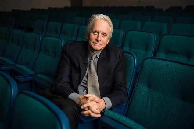 Portrait of Oscar winning actor Michael Douglas sitting in the Boston University George Sherman Union auditorium.