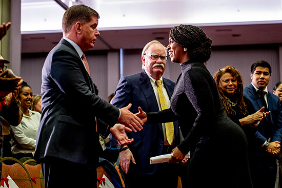 Boston Mayor Martin J. Walsh and United States Representative from Massachusetts Ayanna Pressley shake hands at the Boston University and City of Boston Martin Luther King Day observance at Marsh Chapel.