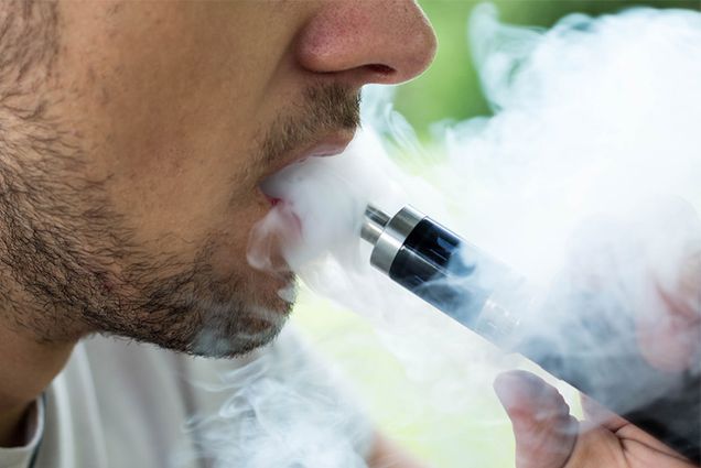 a man uses a vape
