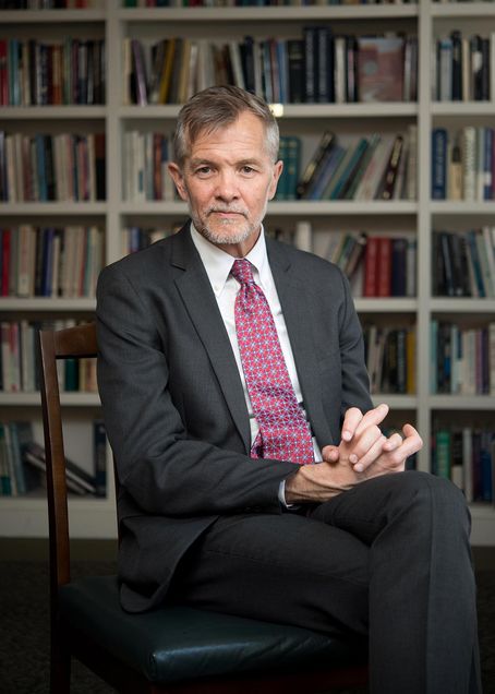 Portrait of David J. Chard, former President of Wheelock College, in his office.