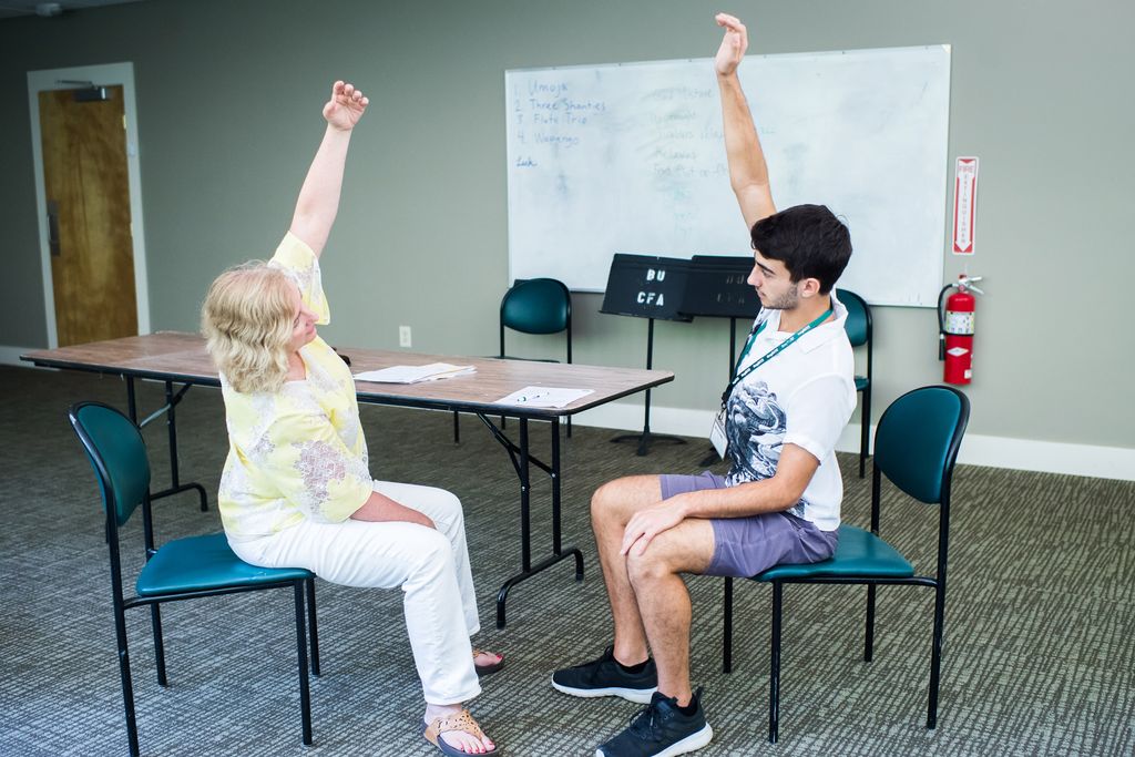 A student mirrors Campbells arm stretch