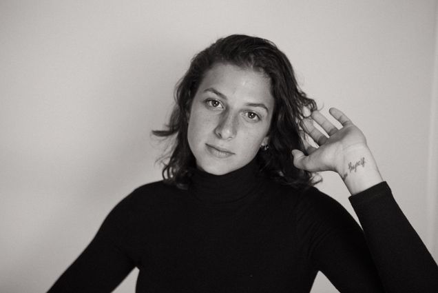 A black and white portrait of Hannah Olson