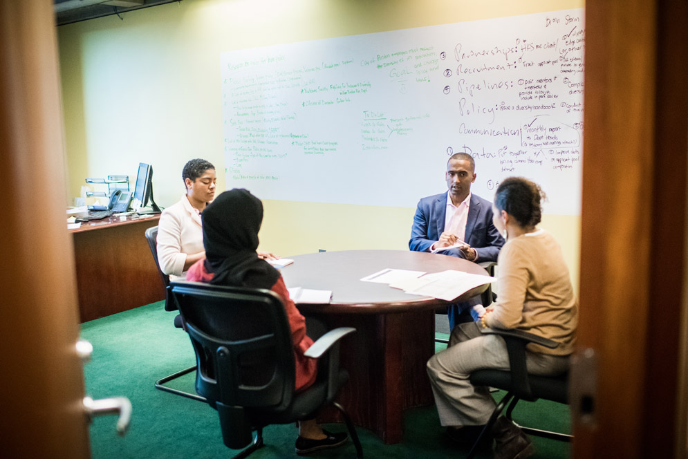 Shakur talks with colleague, Ed Wilson at WeWork
