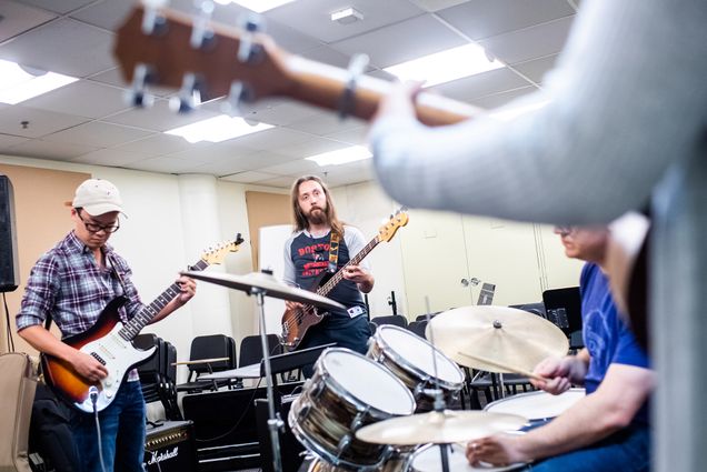Michael Soo (left) and Aidan Linden getting ready to kick out the jams in Rock Band Performance & Pedagogy, a Summer 2 class at the College of Fine Arts