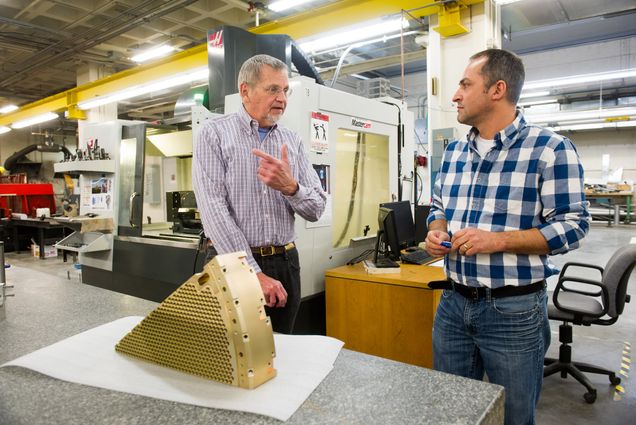 Professor Steven Ahlen and Sif Operations Manager Heitor Maturate with Ahlen's component for Dark Energy Spectroscopic Instrument (DESI)