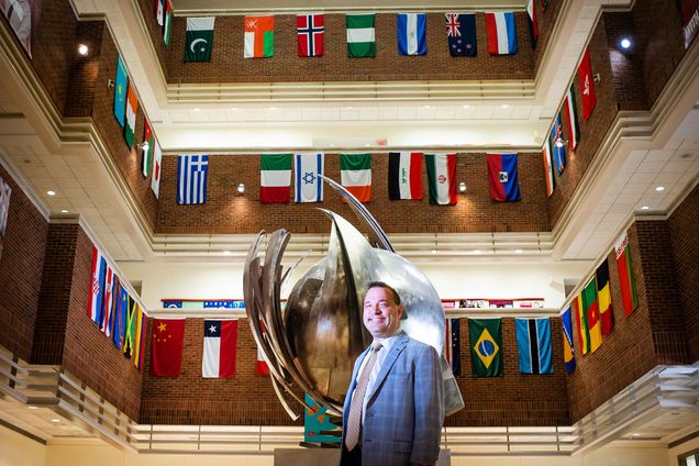 Greg Stoller stands in the Questrom Buisness school lobby
