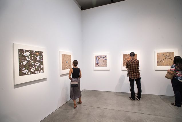 A man and woman admire artwork by Josephine Halvorson at the ICA in Boston.