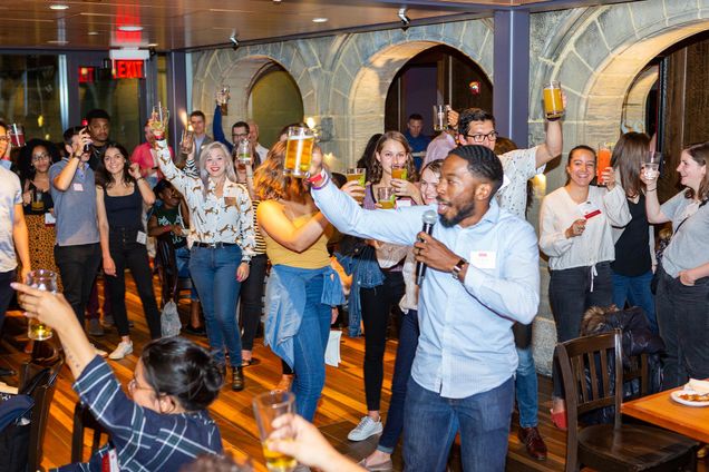 D.A. Whatley, Chair of the Boston University Young Alumni Council, gives a toast during the Young Alumni party at Fuller's BU Pub during Alumni Weekend.