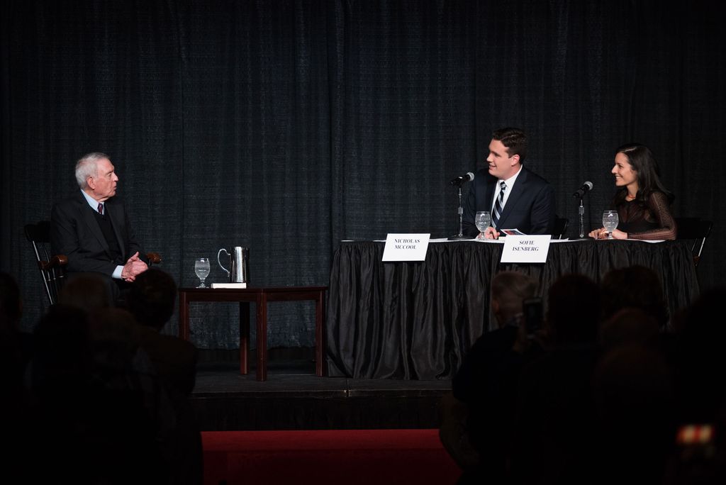 Students Sofie Isenberg (COM'21) and Nicholas McCool (CAS'20, COM'20) interview Dan Rather on stage