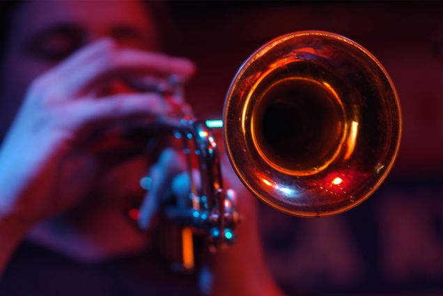 Detail photo of a jazz musician playing the trumpet.