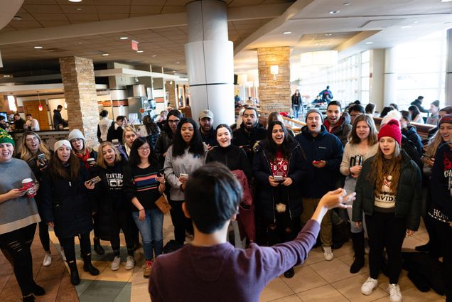 BU on Broadway carols in a dining hall
