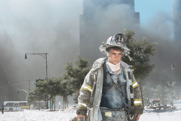 City firefighter walks away from Ground Zero covered in dust on September 11th