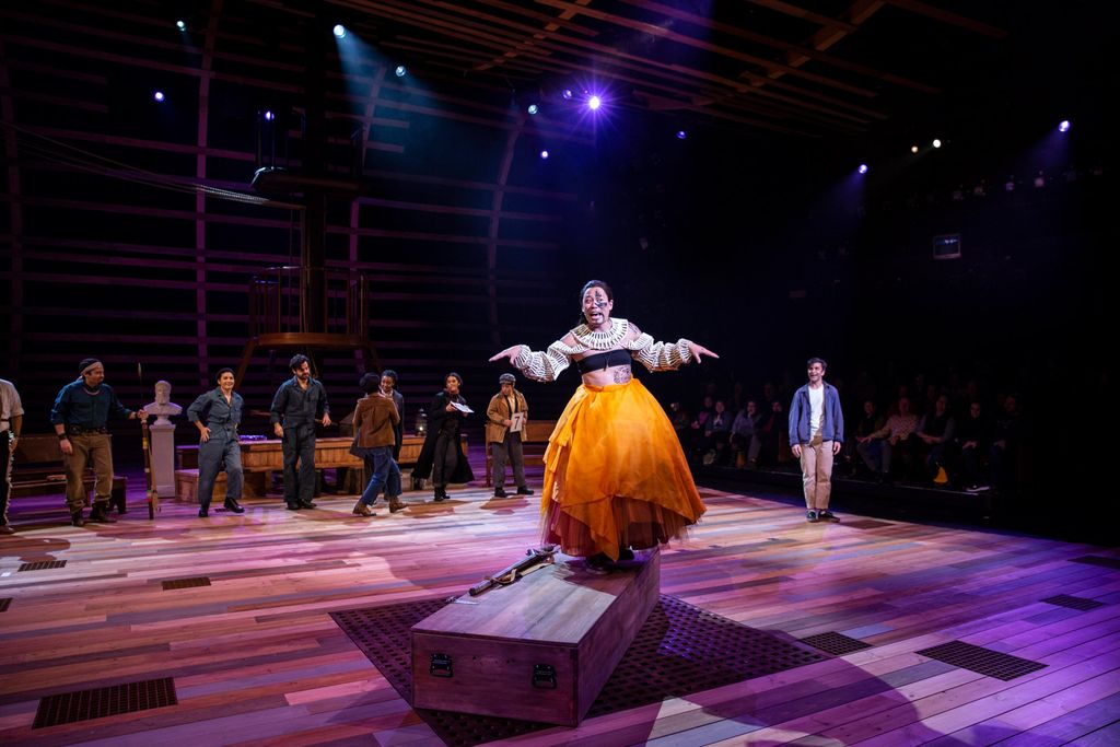 Andrew Cristi, as Queenqueg, wears a bright orange tulle skirt in a scene from the A.R.T.’s world premiere of Moby-Dick