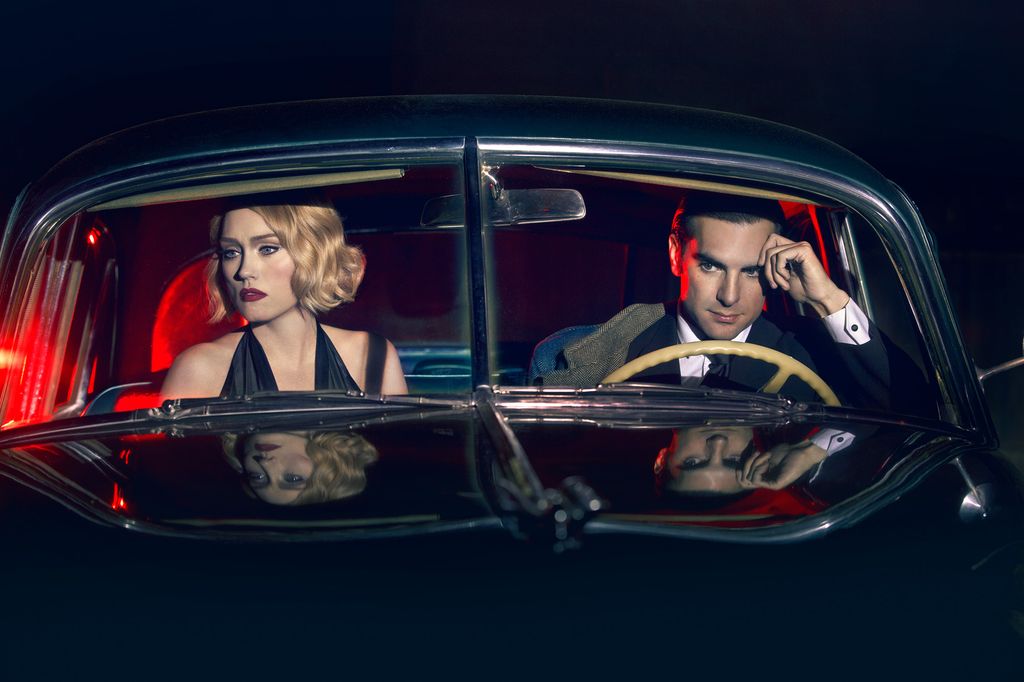 A photo of a man and woman sitting in a car as part of Elizabeth Caren's Double Identity series.
