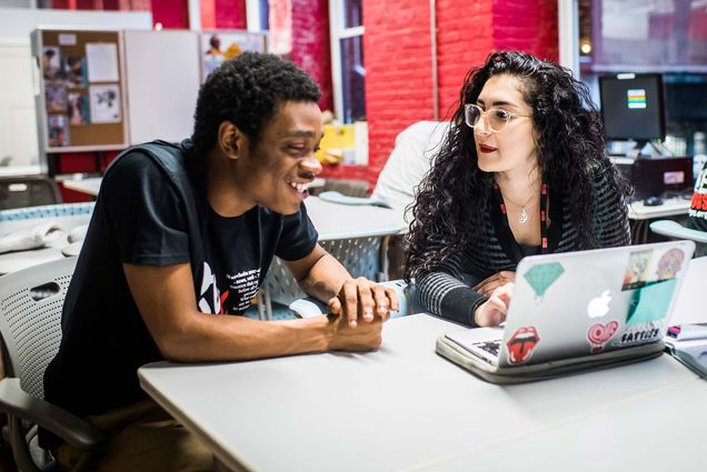 Boston University Wheelock College of Education & Human Development student, Emma Talebzadeh works with Anticious McGee, a senior at Brighton High School.