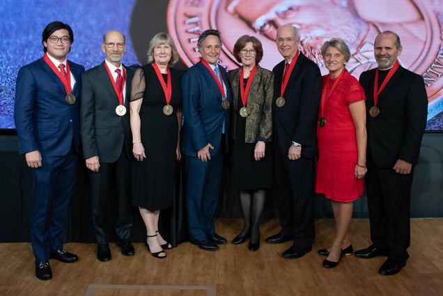 Portrait of the new William Fairfield Warren Society members: Collin Chun Yin Yip (from left), Gary Villella, Susan Villella, Frederick Chicos, Janice Freeman, Kenneth Freeman, Mary Buletza, and the Very Reverend Gary Breton.