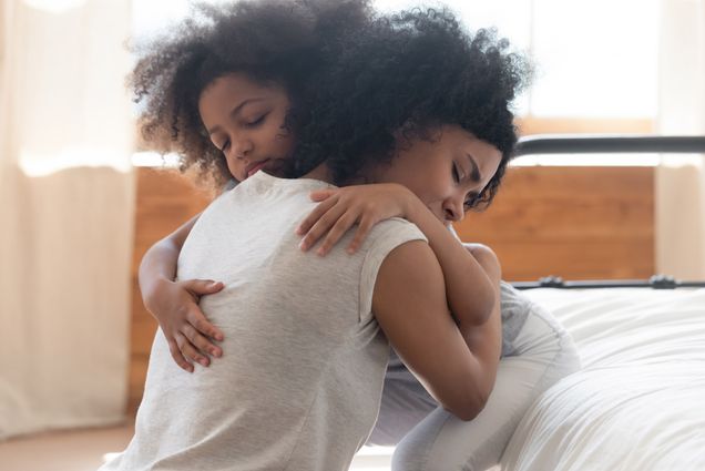 A photo of a mother and child embracing