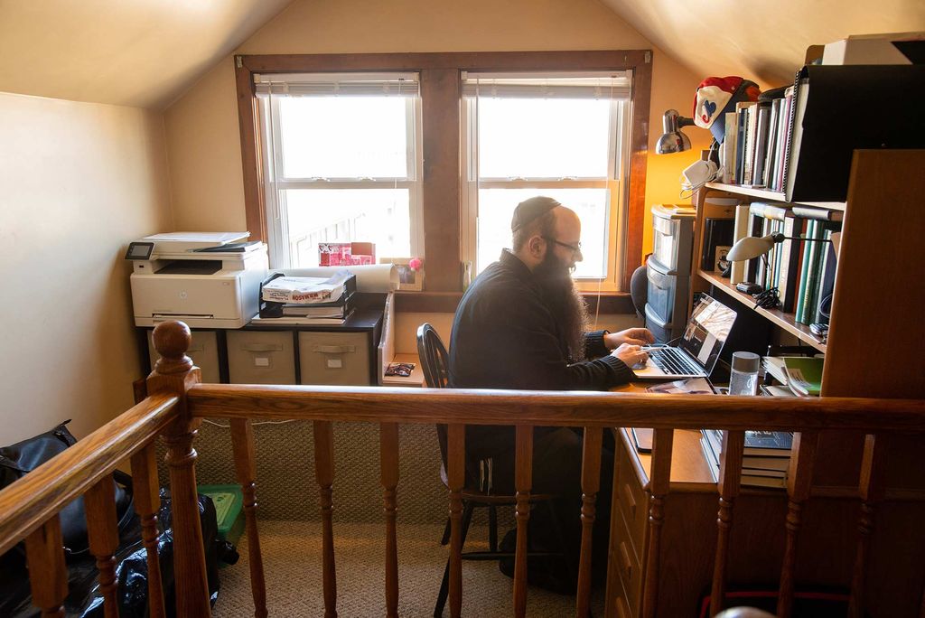 Senior Lecturer in Chemistry at Boston University, Binyomin Abrams, holds remote office hours from his home in Brighton, Mass.