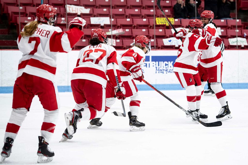 Sammy Davis and BU women's ice hockey team members celebrate after Davis scored a goal in the 2020 Beanpot tournament.