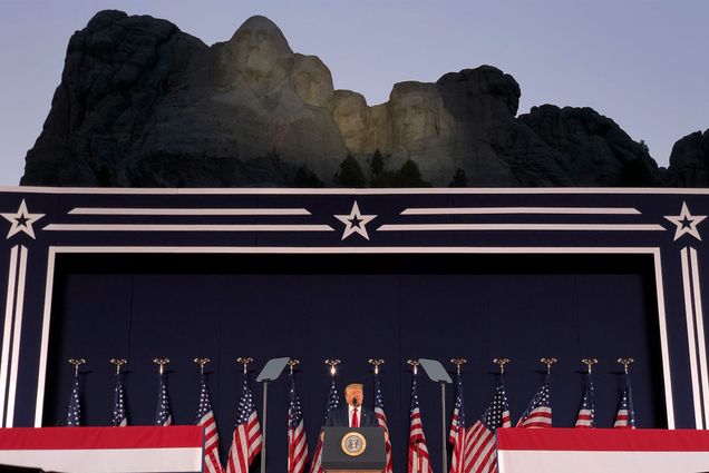 President Donald Trump speaks at Mount Rushmore National Monument Friday, July 3, 2020, in Keystone, S.D. Trump stands at the podium and the faces of Mt. Rushmore are seen behind him.