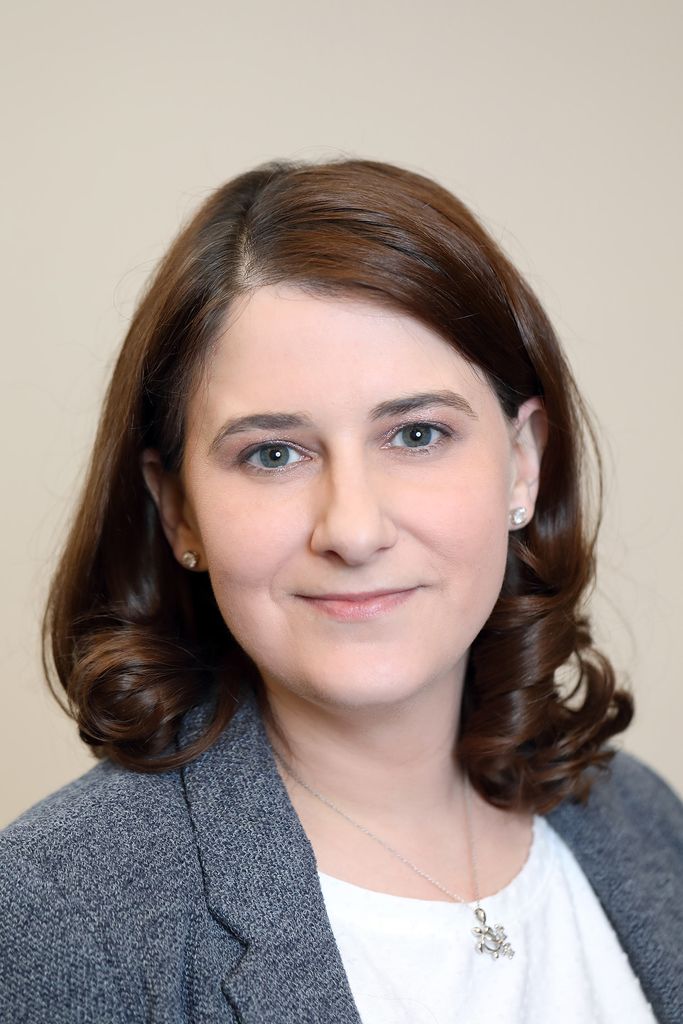 Portrait of Jessica Petrick, School of Medicine  assistant professor of medicine wearing a gray blazer.