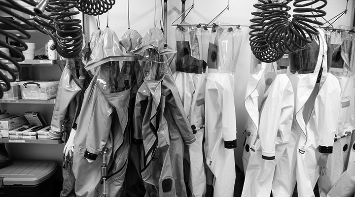 A photo of labcoats hanging up