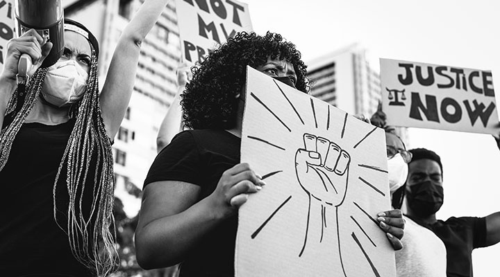 A photo of protesters holding signs 