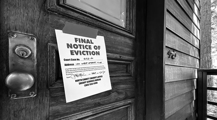 A photo of an eviction notice on a door
