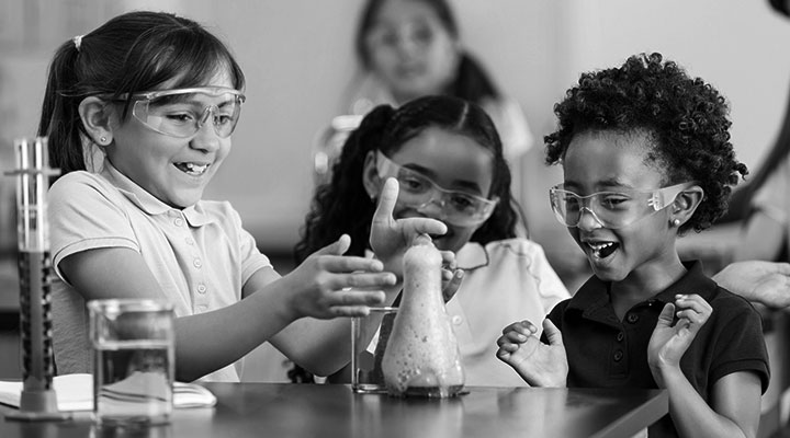 A photo of young students conducting a science experiment