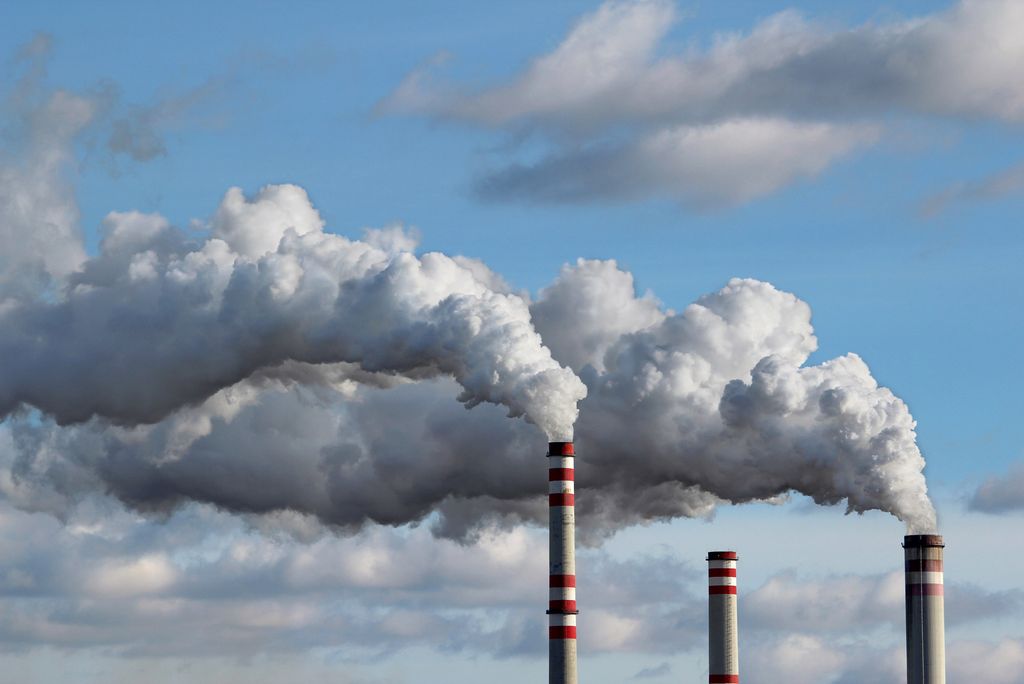 A photo of smokestacks emitting smoke