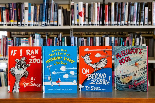 A photo of the Dr. Seuss books "If I Ran a Zoo," "And to Think I Saw it on Mulberry Street," "On Beyond Zebra," and "McElligot's Pool"