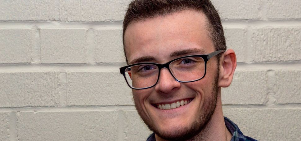 A photo of Graham Grail smiling at the camera