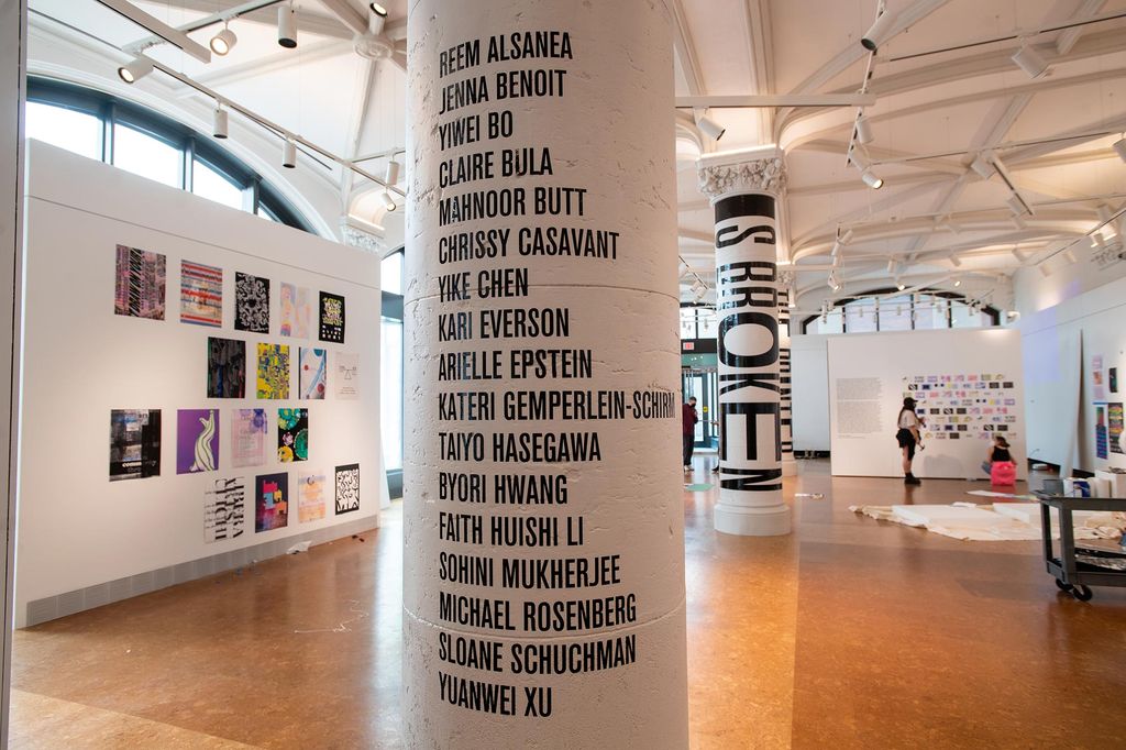 Photo of a pole of the exhibition that displays the names of the featured artists and the show’s title. Artists listed in big black block letters are as follows: Reem Alsanea, Jenna Benoit, Yiwei Bo, Claire Bula, Mahnoor Butt, Chrissy Casavant, Yike Chen, Kari Everson, Arielle Epstein, Kateri Gemperlein-Schirm, Taiyo Hasegawa, Byori Hwang, Faith Huishi Li, Sohini Mukherjee, Michael Rosenberg, Sloane Schuchman, and Yuanwei Xu.