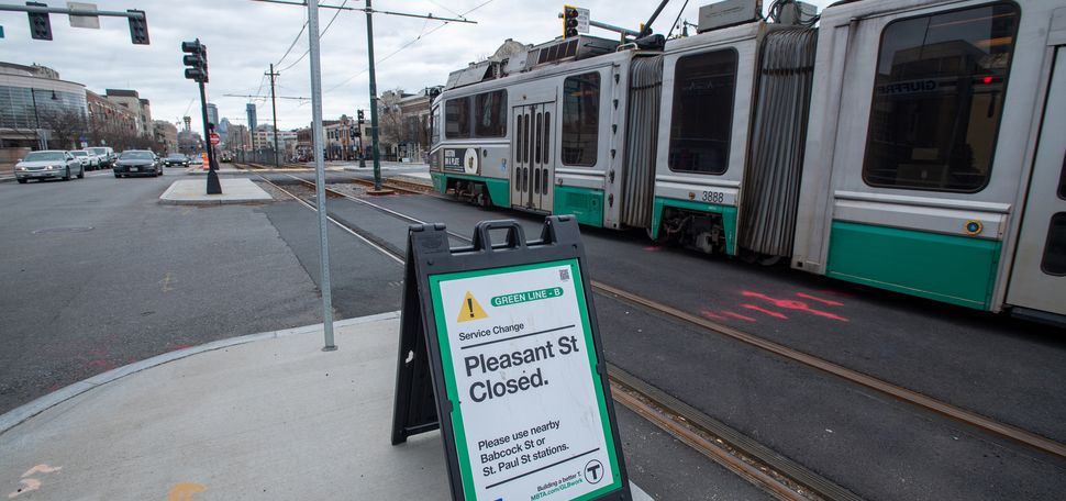 A photo of the green line b branch with a sign that says "Pleasant St. is Closed"