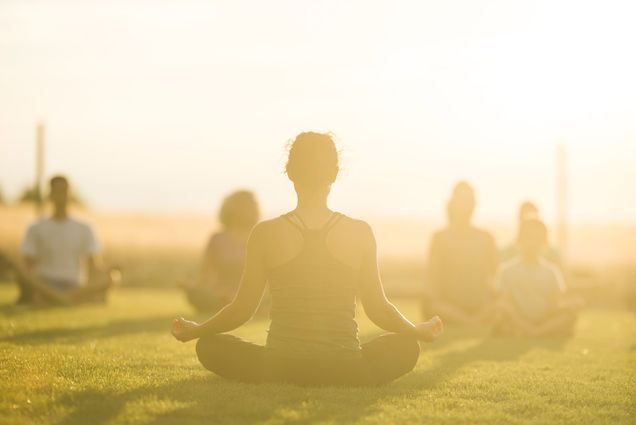 A photo of an outdoor yoga class