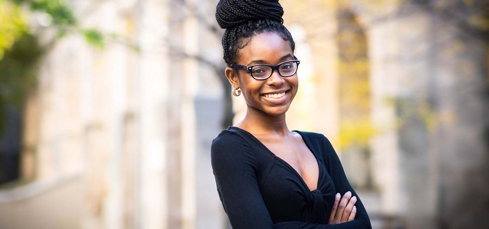 Portrait of Thomas M. Menino Scholar, Alicia Dennery outside on the Boston University Charles River campus.