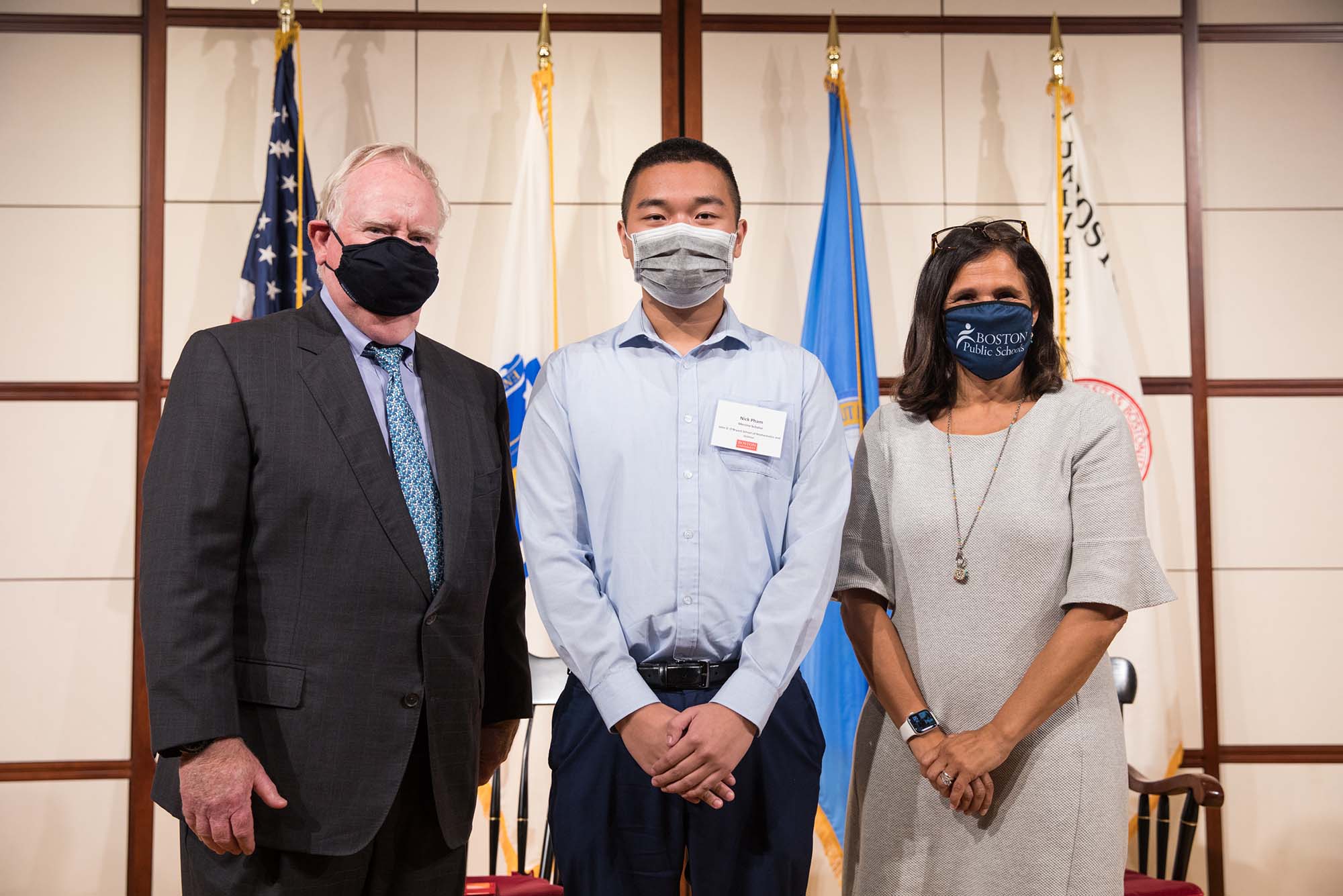 BU Menino Scholar Nick Pham poses with Boston University President Robert A. Brown and Boston Schools Superintendent Brenda Cassellius at scholarship awards ceremony.