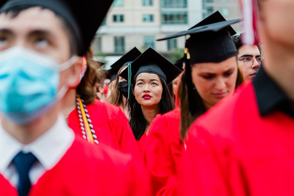 Graduating students watch the Class of 2020 Commencement ceremony on Nickerson Field.