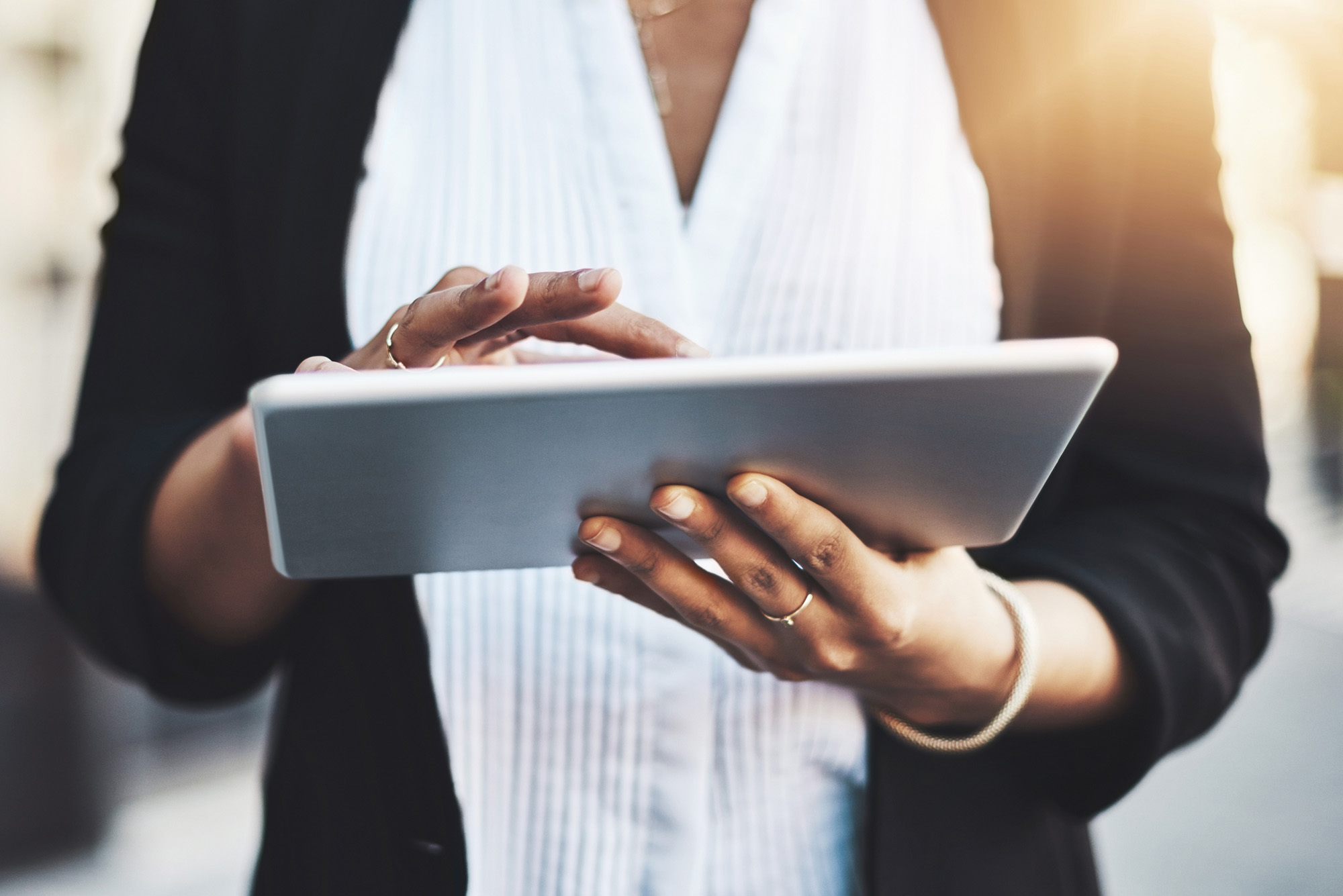 Closeup shot of a businesswoman using a digital tablet in the city
