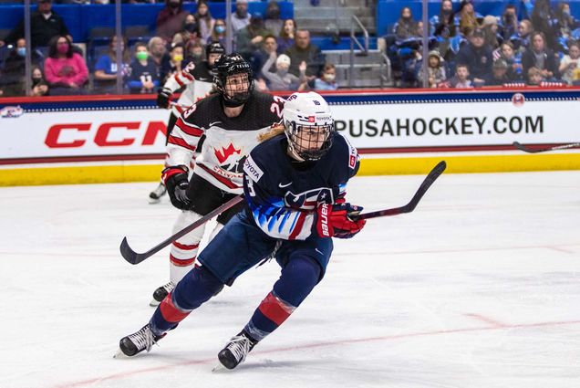 Photo of Jesse Compher (SHA’21) playing during the 2016 U-18 World Junior Championship. She is tailed by a Canadian defender.