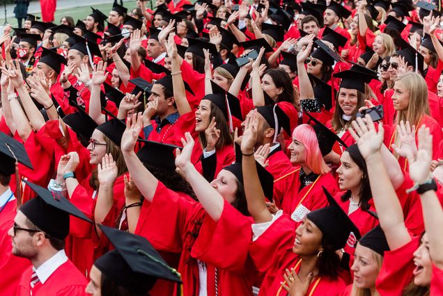 A sea of Boston University graduates in caps and gowns