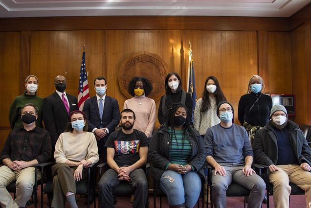 Students in Spencer Piston’s Race at the Center of U.S. Politics course with Lynn mayor Jared Nicholson (back row, third from left) and members of the Lynn Racial Justice Coalition in Lynn City Hall. Photo by Jakob Menendez