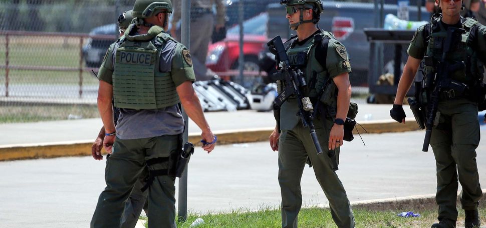 Law enforcement personnel stand outside Robb Elementary School following a shooting, Tuesday, May 24, 2022, in Uvalde, Texas. (AP Photo/Dario Lopez-Mills)