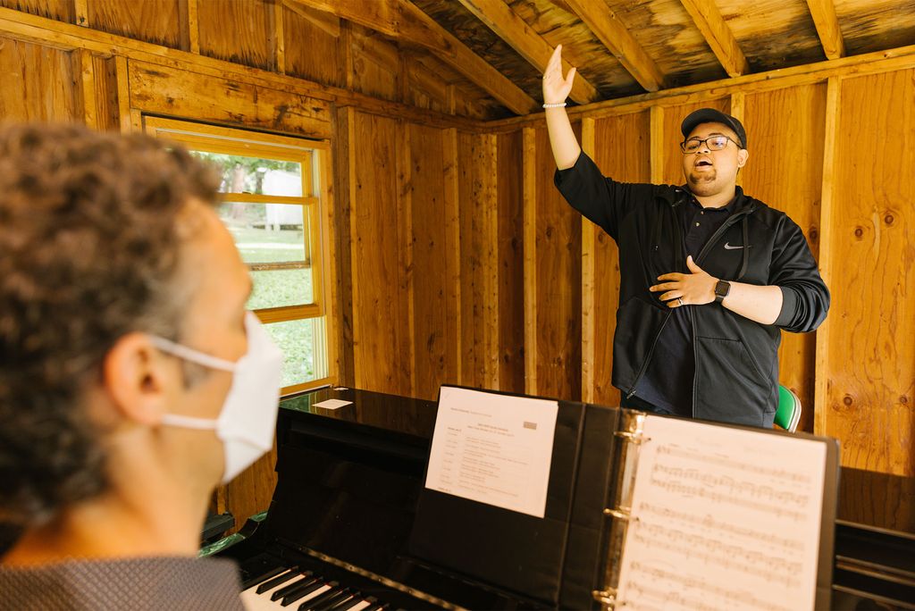 Parker’s week includes a lot of singing. Here, he practices with Gregory Zavracky, BUTI vocal instructor, at the piano.