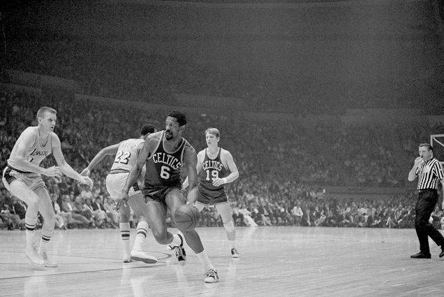 Black and white photo of Bill Russell, of the Boston Celtics, driving to the basket against the Los Angeles Lakers in the teams' final NBA playoff game in Los Angeles, May 5, 1969.